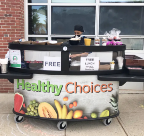school lunch cart stocked with various lunch items for students